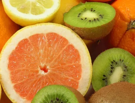 Brand food photo of sliced grapefruit, oranges and kiwis